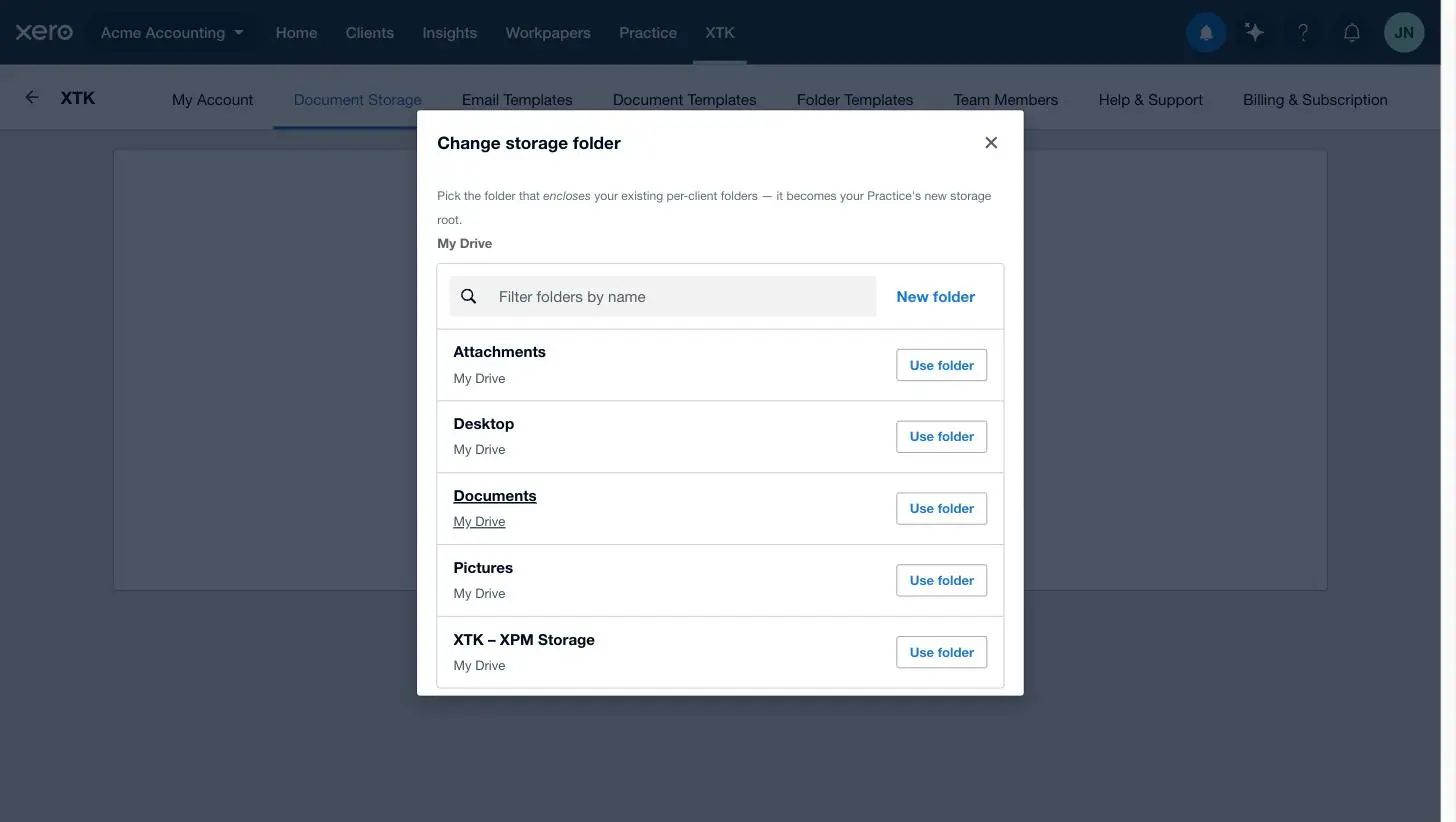The Change storage folder browser in XTK listing the drive's folders, each with a Use folder button and a filter box
